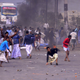 Protesters throw stones at the police at Santragachi in Howrah district of West Bengal on Dec.14.